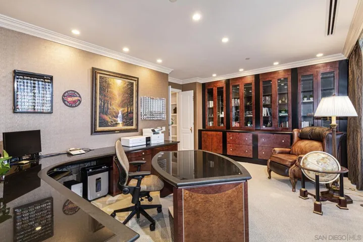 This well-designed office offers a third bedroom option if needed.  It is immediately adjacent to a library/display/office area.