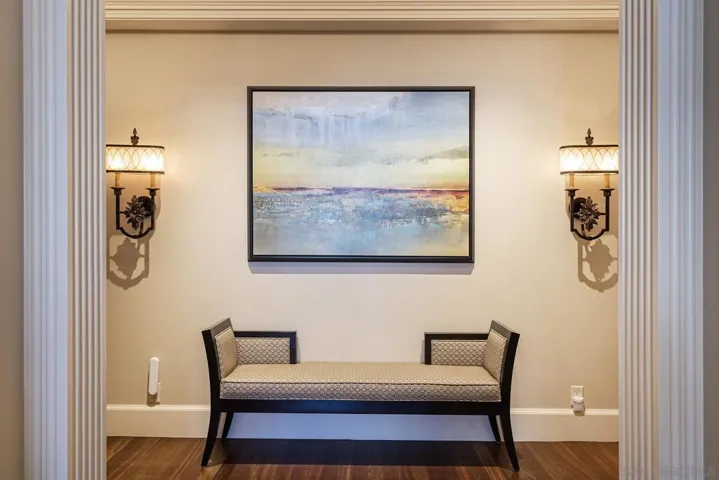 A semi-private formal entry to the primary suite sets an elegant, inviting tone.