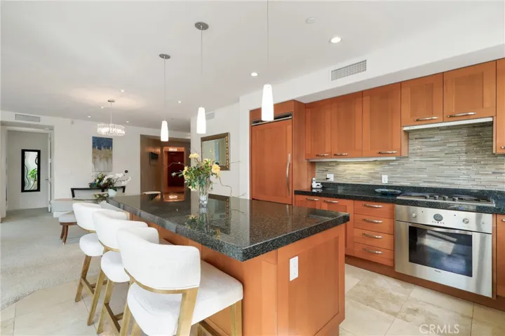 Large kitchen with center island + bar seating