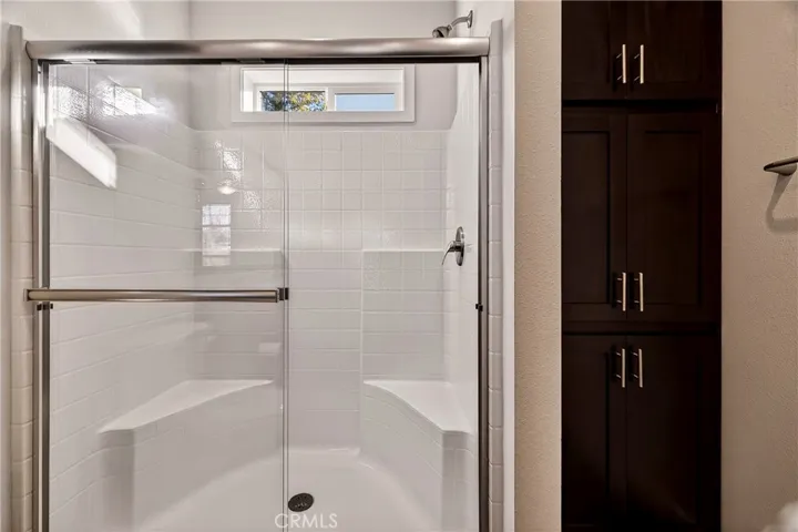 Primary Walk-In Shower With Seating