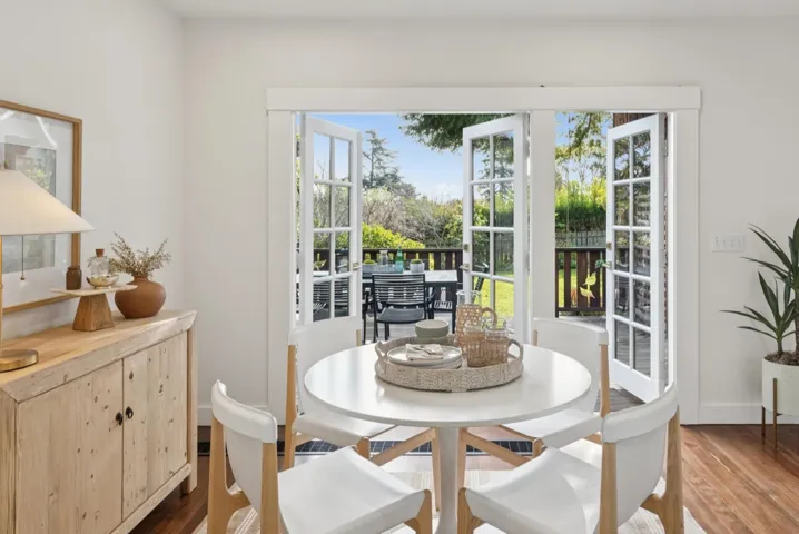 DOUBLE FRENCH DOORS THAT OPEN TO THE DECK