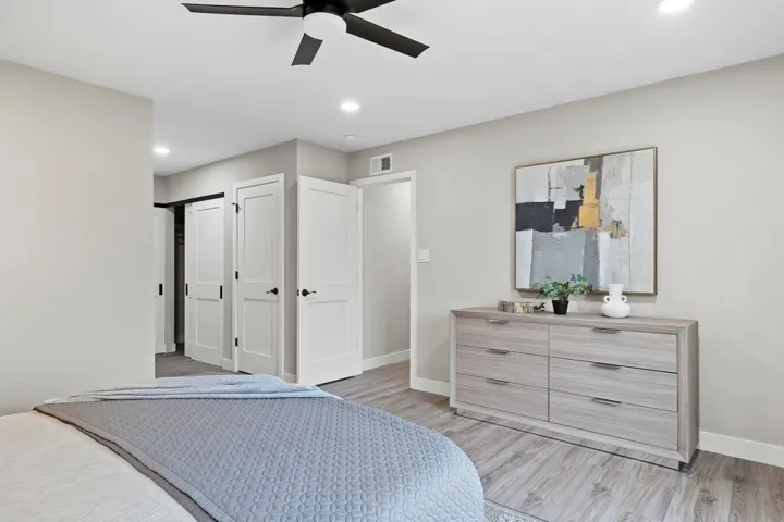 Bedroom featuring light wood finished floors, a ceiling fan, a closet, and recessed lighting