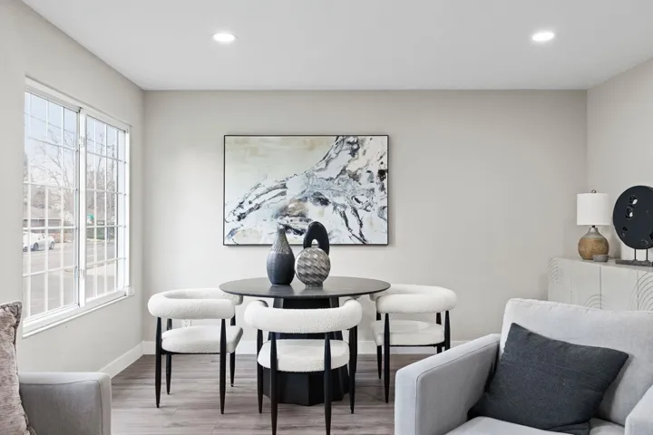 Office with wood finished floors and recessed lighting