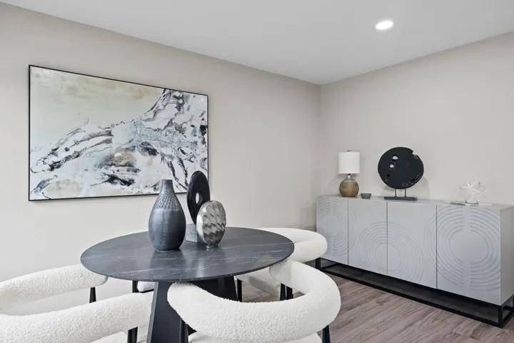 Dining area featuring wood finished floors and recessed lighting