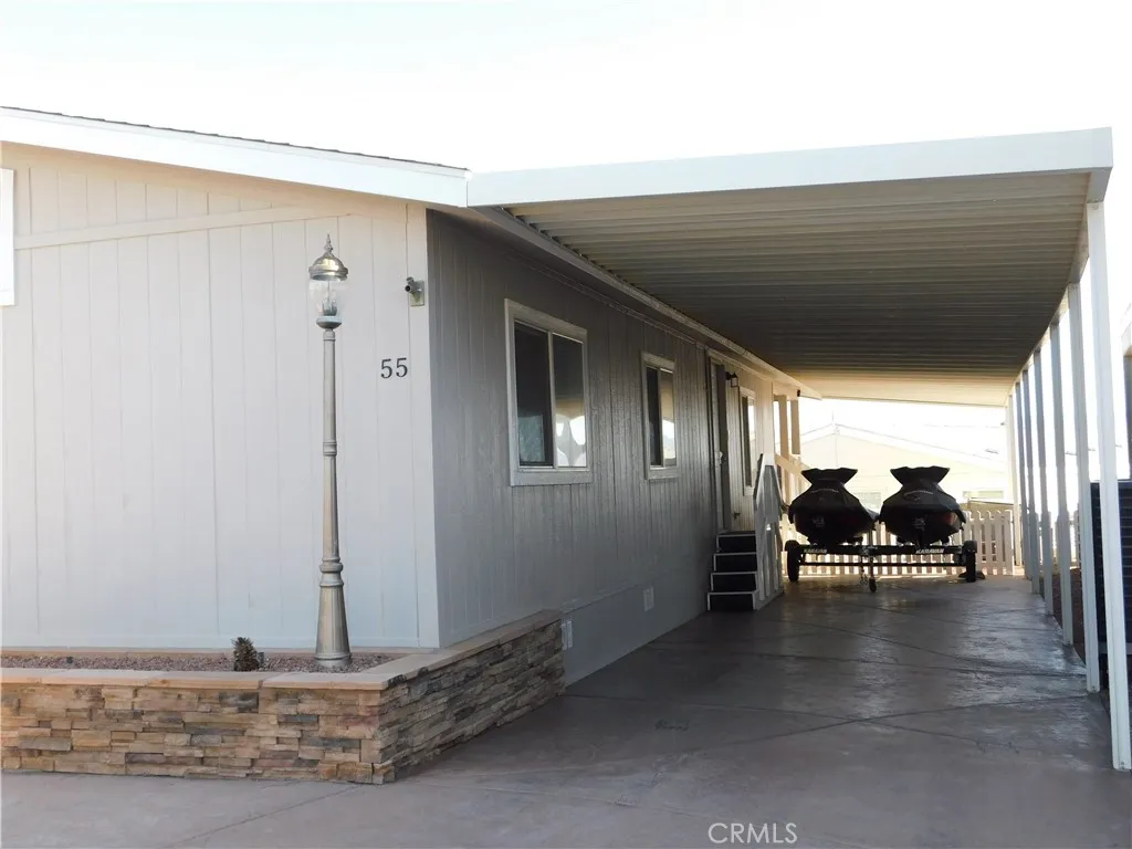Front of home with large carport