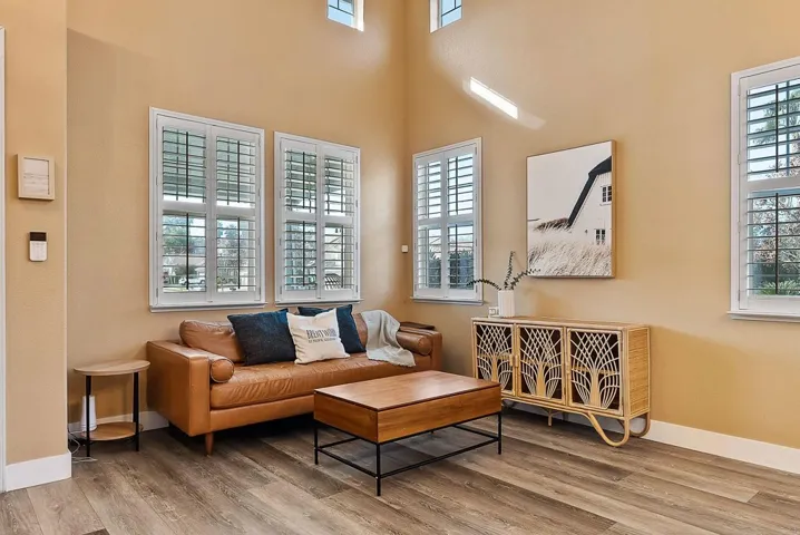 Living area featuring light wood-type flooring and healthy amount of natural light