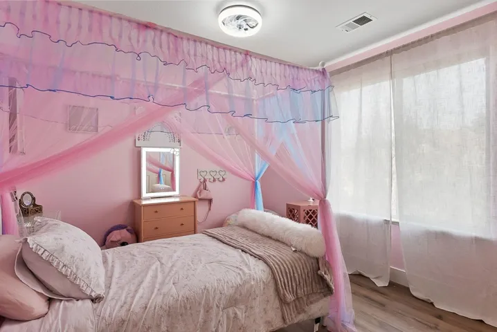 Bedroom with wood finished floors