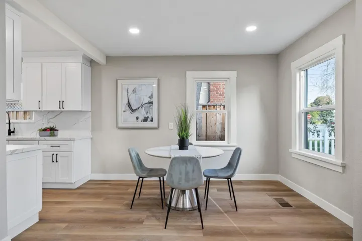 Dining area featuring light wood finished floors and recessed lighting