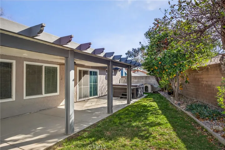 Mature fruit trees including Orange, Lemon, and Apple.