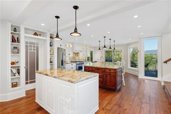 VIEW OF KITCHEN WORK ISLAND AND CENTER ISLAND