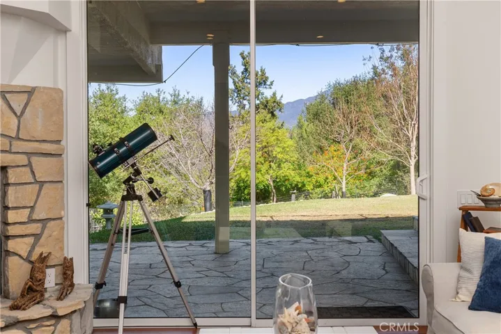 VIEW FROM DOWNSTAIRS LIVING ROOM SLIDERS TO PATIO