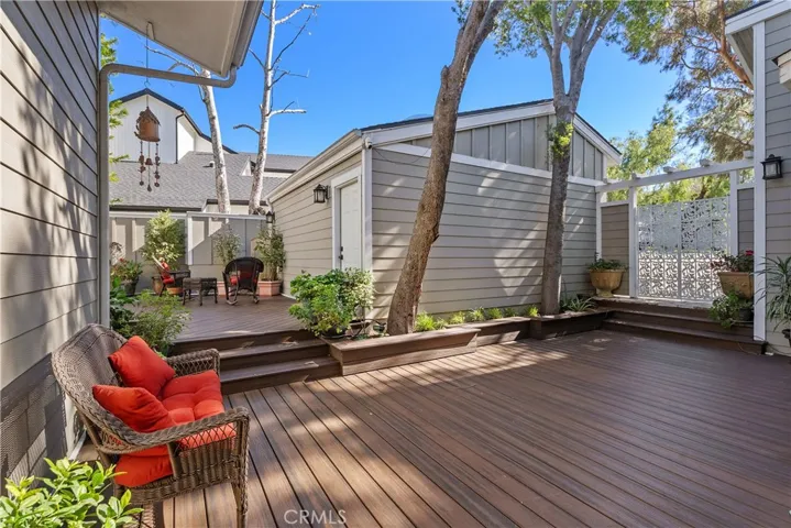 VIEW FROM FRONT DOOR OF DECK AND 2 CAR GARAGE