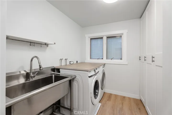 DOWNSTAIRS LAUNDRY ROOM WITH UTILITY SINK