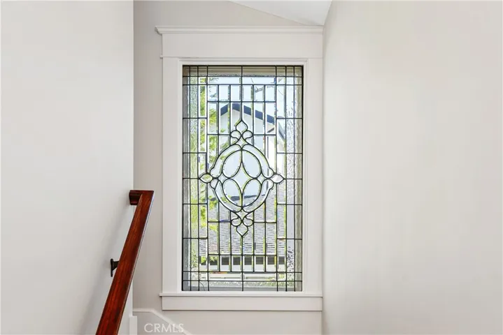 STAINED GLASS WINDOW ON STAIRS