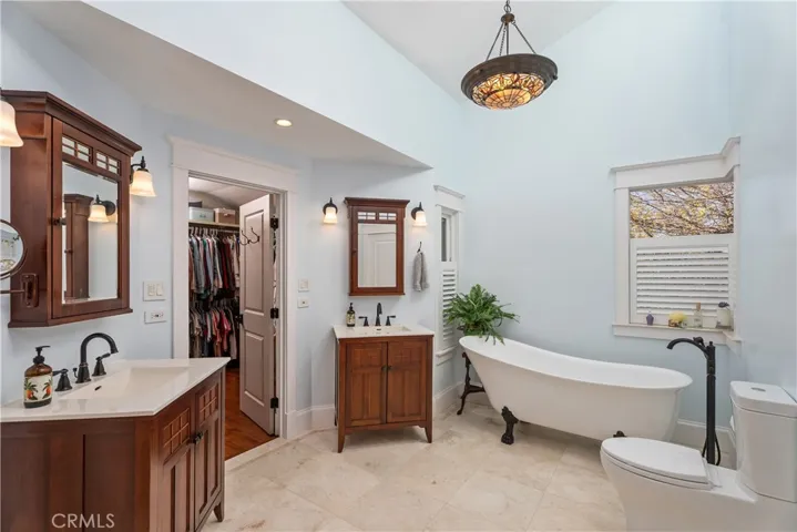 MASTER BATH AREA WITH 2 VANITIES AND A WALK-IN CLOSET