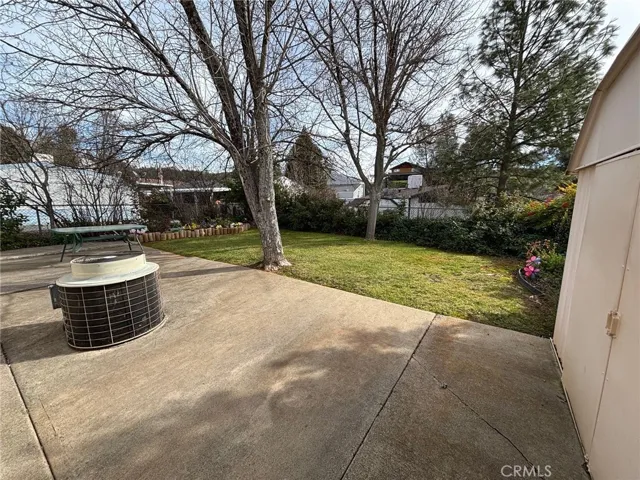 Backyard with shed storage.