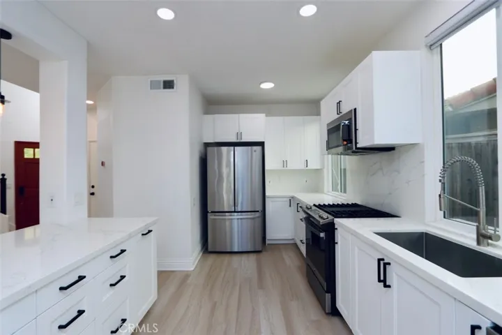 Remodeled Kitchen- New Cabinets, GE Profile Appliances, Quartz Countertops - Open to Living & Dining Rooms