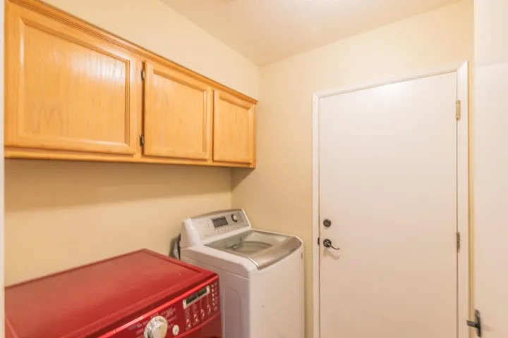 Washroom with independent washer and dryer and cabinet space