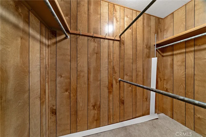 Walk-in closet in primary bedroom