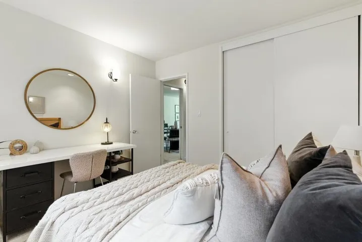 Bedroom featuring a closet and a desk