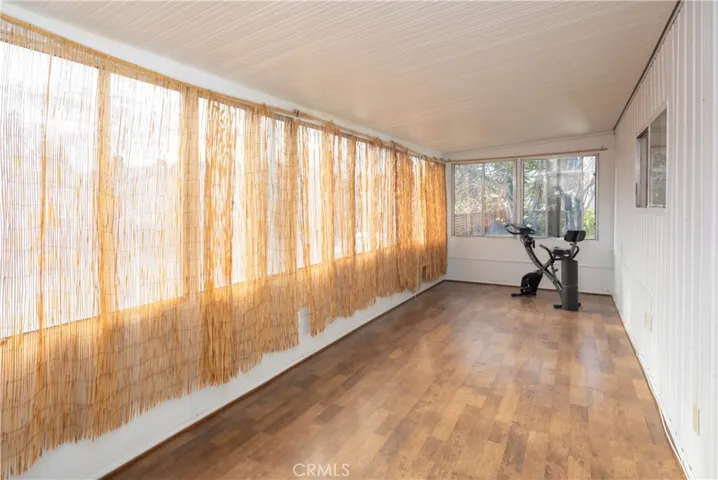 Exercise with a view of the private backyard with a Mandarin Orange tree, Citron aka Buddha's Hand, Granny Smith Apple tree, ornamental Cherry tree, Gikoba, Morninga Sapling in Terra Cotta.