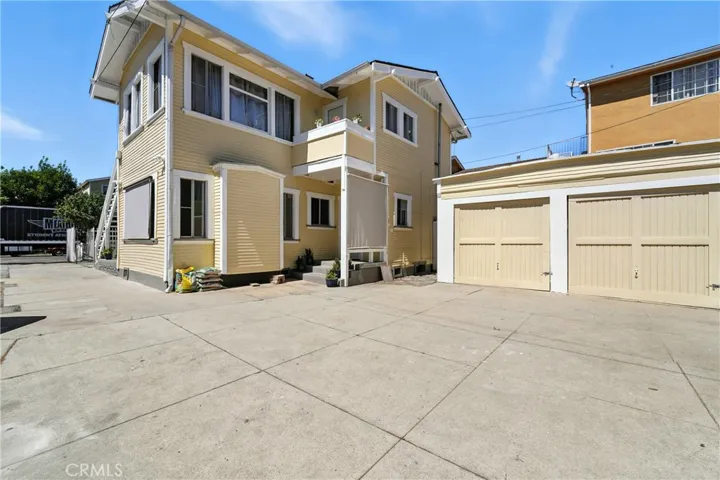 Rear of the front house and unit.  2 of the 4 garages.