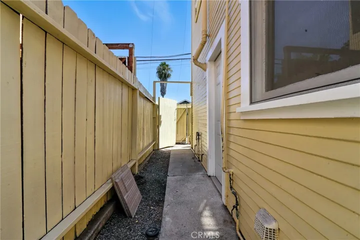Side of the rear garages and unit toward alley.