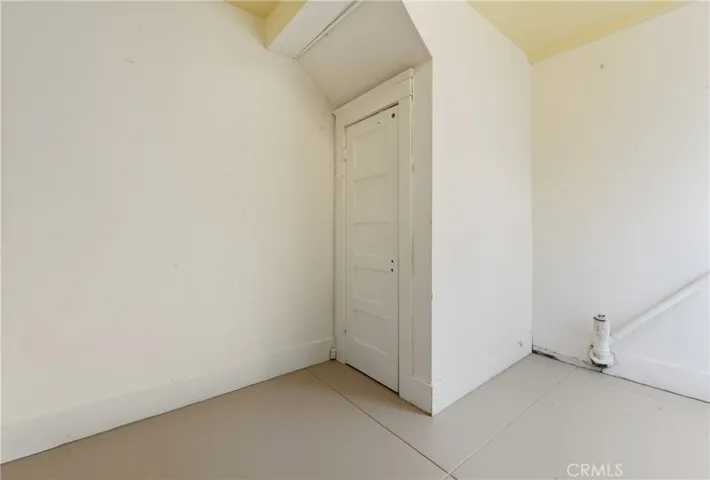 Large storage room next to rear garages.