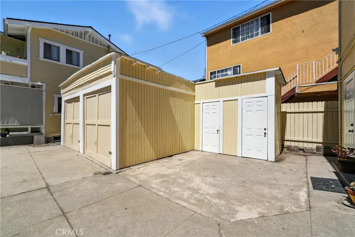 2 large storage rooms (with white doors)next to garages.