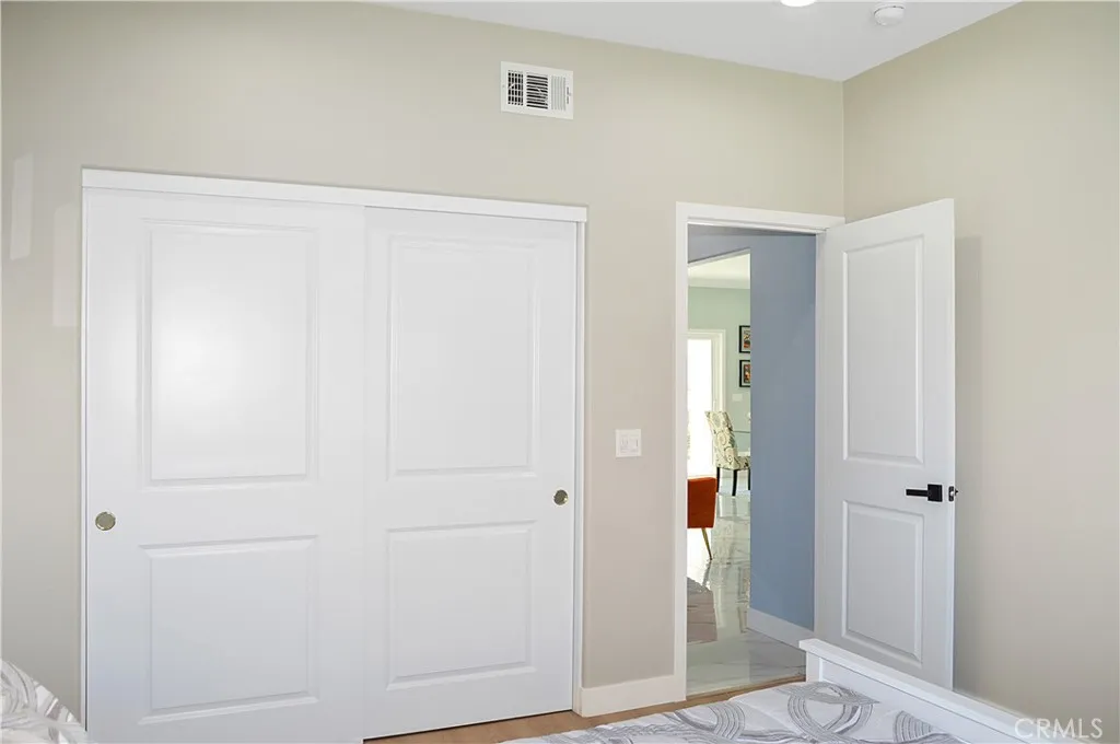 A quick stop at the main floor bedroom and bath before we head upstairs. The 4th bedroom in the main house offers gorgeous mountain views, fabulous flooring, recessed lighting, and is pre-wired for a ceiling fan and a TV (like all of the bedrooms).