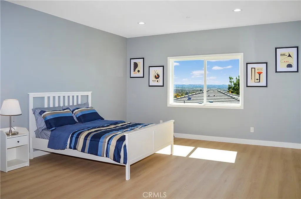 The very spacious primary bedroom sits at the end of the hall upstairs and offers an en suite bath, walk-in closet, gorgeous mountain views, fabulous flooring, recessed lighting, and is pre-wired for a ceiling fan and a TV (like all of the bedrooms).