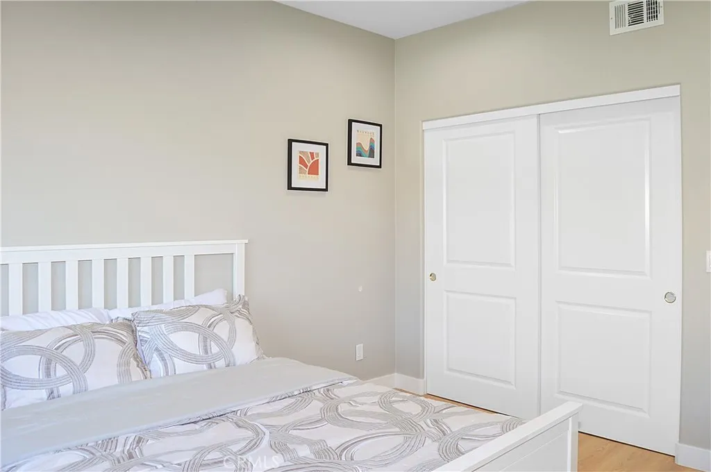 A quick stop at the main floor bedroom and bath before we head upstairs. The 4th bedroom in the main house offers gorgeous mountain views, fabulous flooring, recessed lighting, and is pre-wired for a ceiling fan and a TV (like all of the bedrooms).