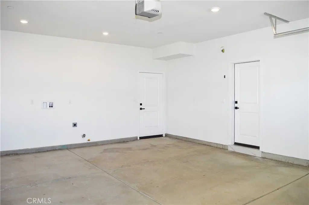 The 2-car garage offers direct access to the main house and a door to the backyard. Laundry hook-ups for the main house are located here. The ADU has its own indoor laundry room.