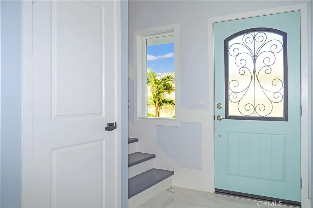 There's a handy closet under the stairs near the entry and a second one next to the bathroom (not pictured here, but visible in the walk-through virtual tour). Let's head up the stairs.