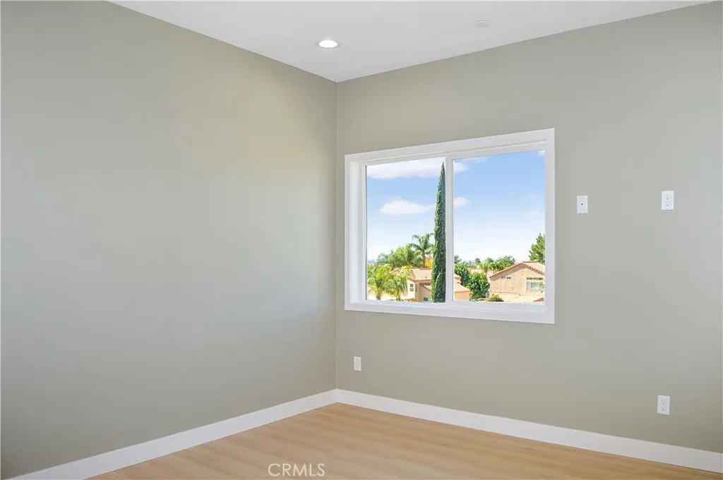 The 2nd bedroom upstairs offers more views, fabulous flooring, recessed lighting and is pre-wired for a ceiling fan and a TV