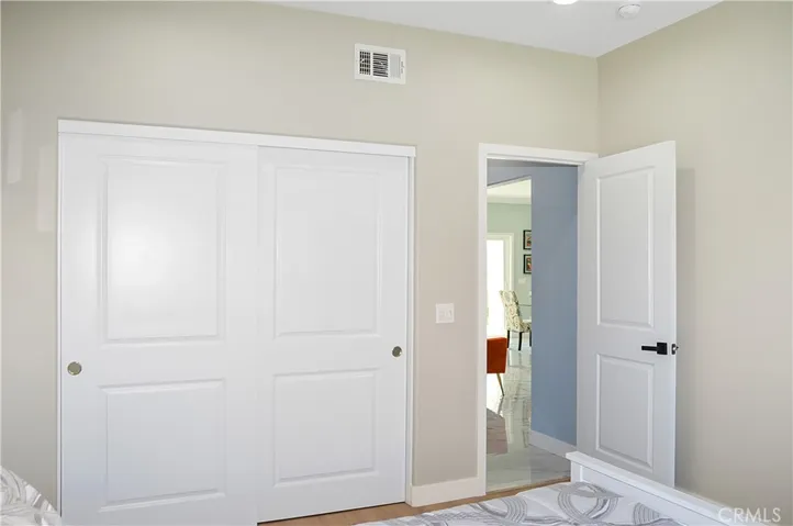 A quick stop at the main floor bedroom and bath before we head upstairs. The 4th bedroom in the main house offers gorgeous mountain views, fabulous flooring, recessed lighting, and is pre-wired for a ceiling fan and a TV (like all of the bedrooms).