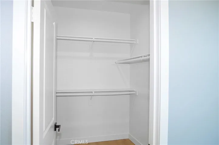 Primary bedroom walk-in closet