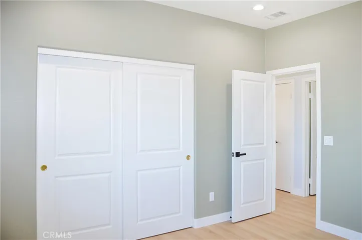 The 2nd bedroom upstairs offers more views, fabulous flooring, recessed lighting and is pre-wired for a ceiling fan and a TV