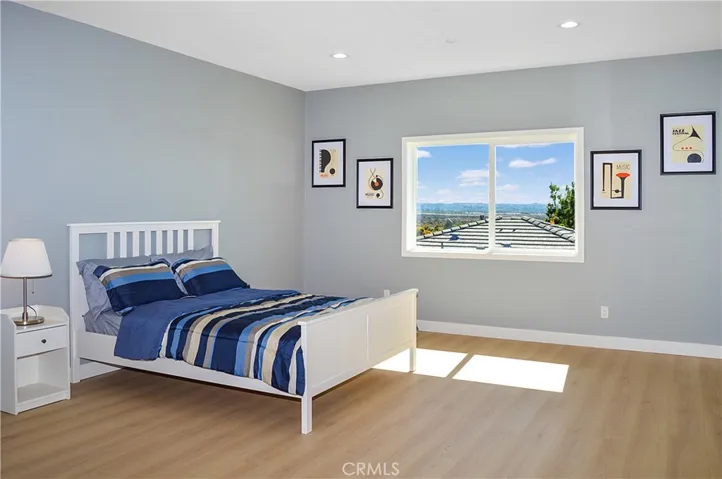 The very spacious primary bedroom sits at the end of the hall upstairs and offers an en suite bath, walk-in closet, gorgeous mountain views, fabulous flooring, recessed lighting, and is pre-wired for a ceiling fan and a TV (like all of the bedrooms).