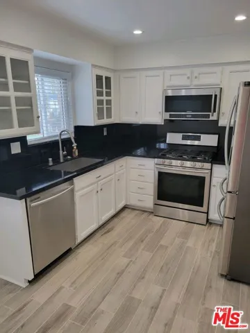 Redone kitchen with travertine