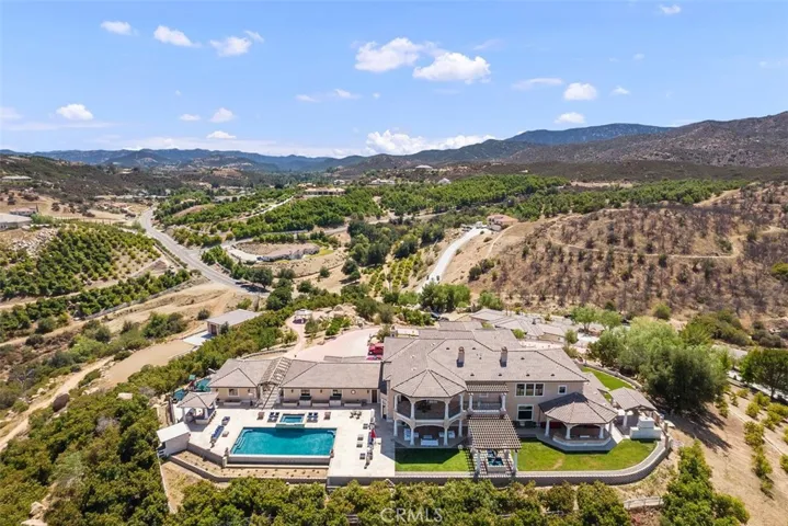 Income producing avocado grove surrounds the property.
