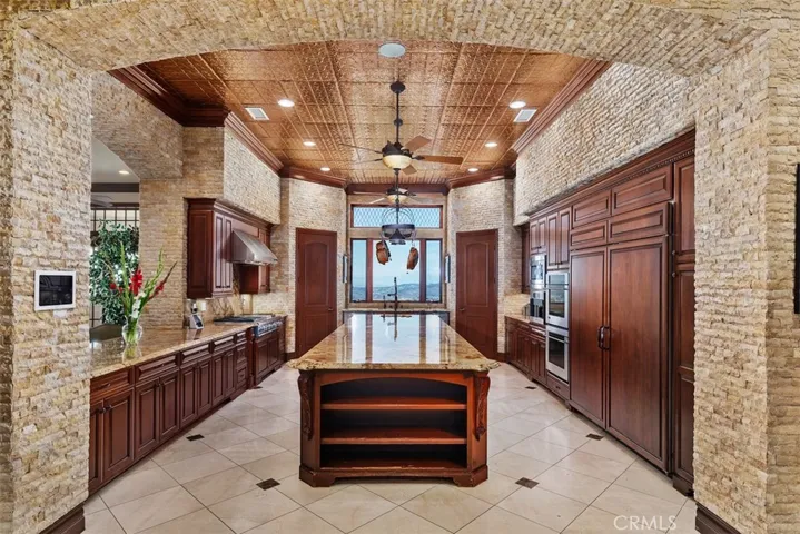 Gourmet chef's kitchen w/ copper ceiling.
