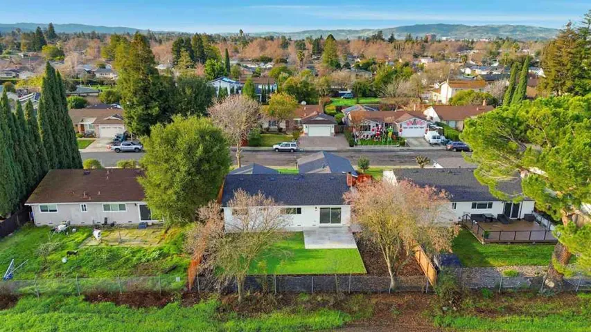 Aerial view of residential area with a mountain backdrop