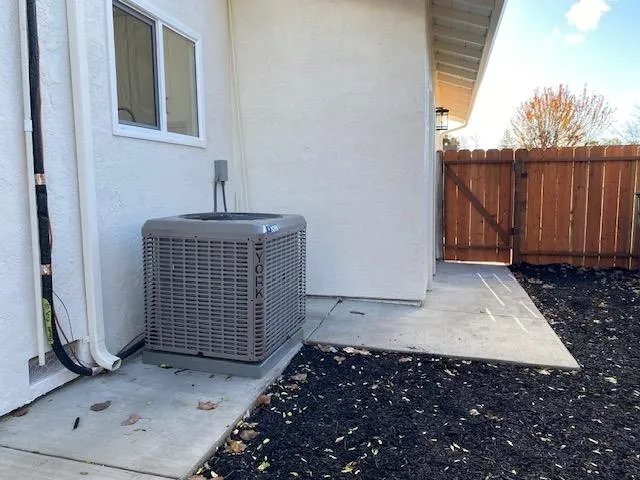 Exterior view of a gate and stucco siding