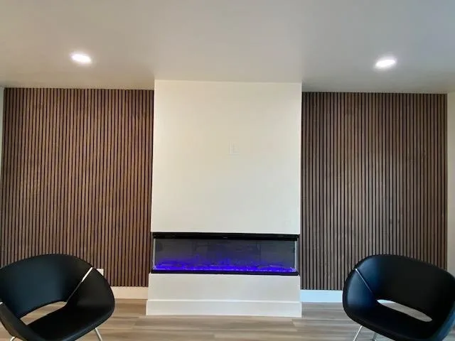 Reception area with recessed lighting and a glass covered fireplace