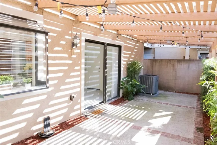shaded concrete patio backyard