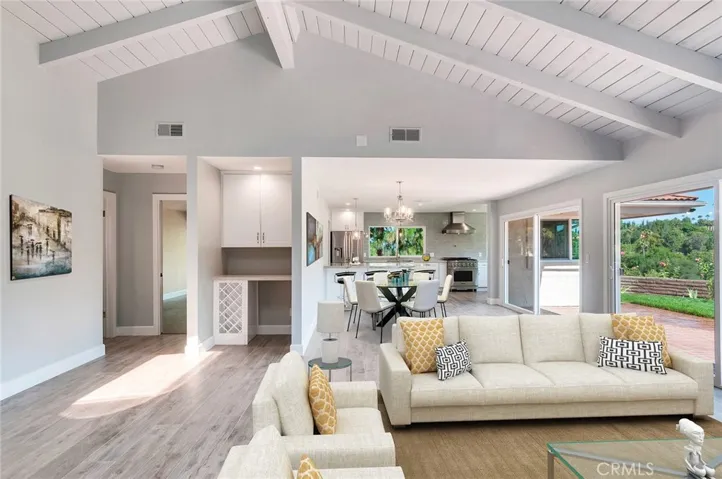 Virtually staged living room and dining with a peek at the kitchen.  Everything is newer!