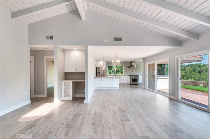 Living room looking toward the dining room and kitchen with hint of the view