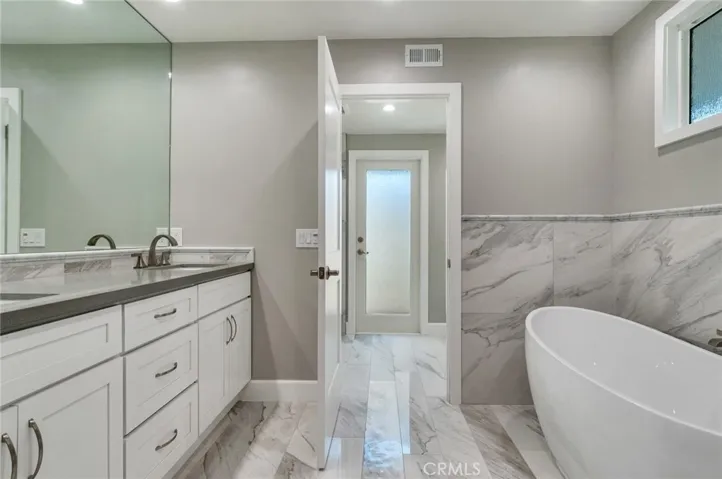 Primary bath with dual sinks and fiberglass soaking tub