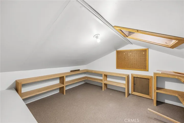 Attic storage room entrance at top of stairs on second floor